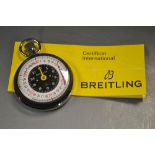 A Breitling stopwatch, certificate, date