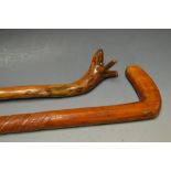 A treen walking cane, the handle carved