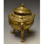 A 19th century brass tripod inkwell