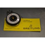 A Breitling stopwatch, certificate, date