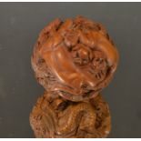 A Chinese boxwood ball, profusely carved