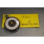 A Breitling stopwatch, certificate, date