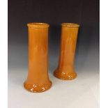 A pair of Bretby cylindrical vases, mott