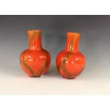 A pair of Bretby bottles vases, possibly