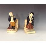 A pair of Bretby Dickens figural bookend