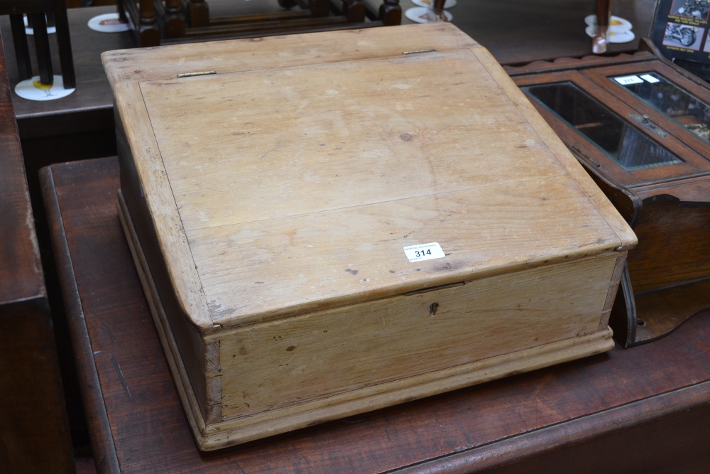 A pine counter top child's desk, slope h