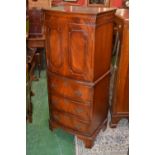 A mahogany bow fronted cocktail cabinet