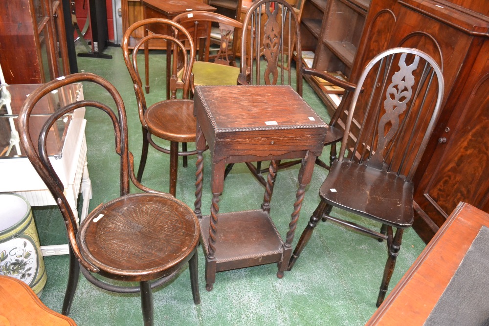 An oak barley twist canteen table, c.1935;  two bentwood kitchen chairs; two dining chairs (5)
