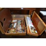 Two artist's paint boxes with palettes, paints and brushes, and Daler boards