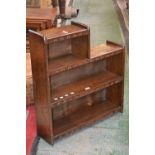 A small oak four tier bookcase.