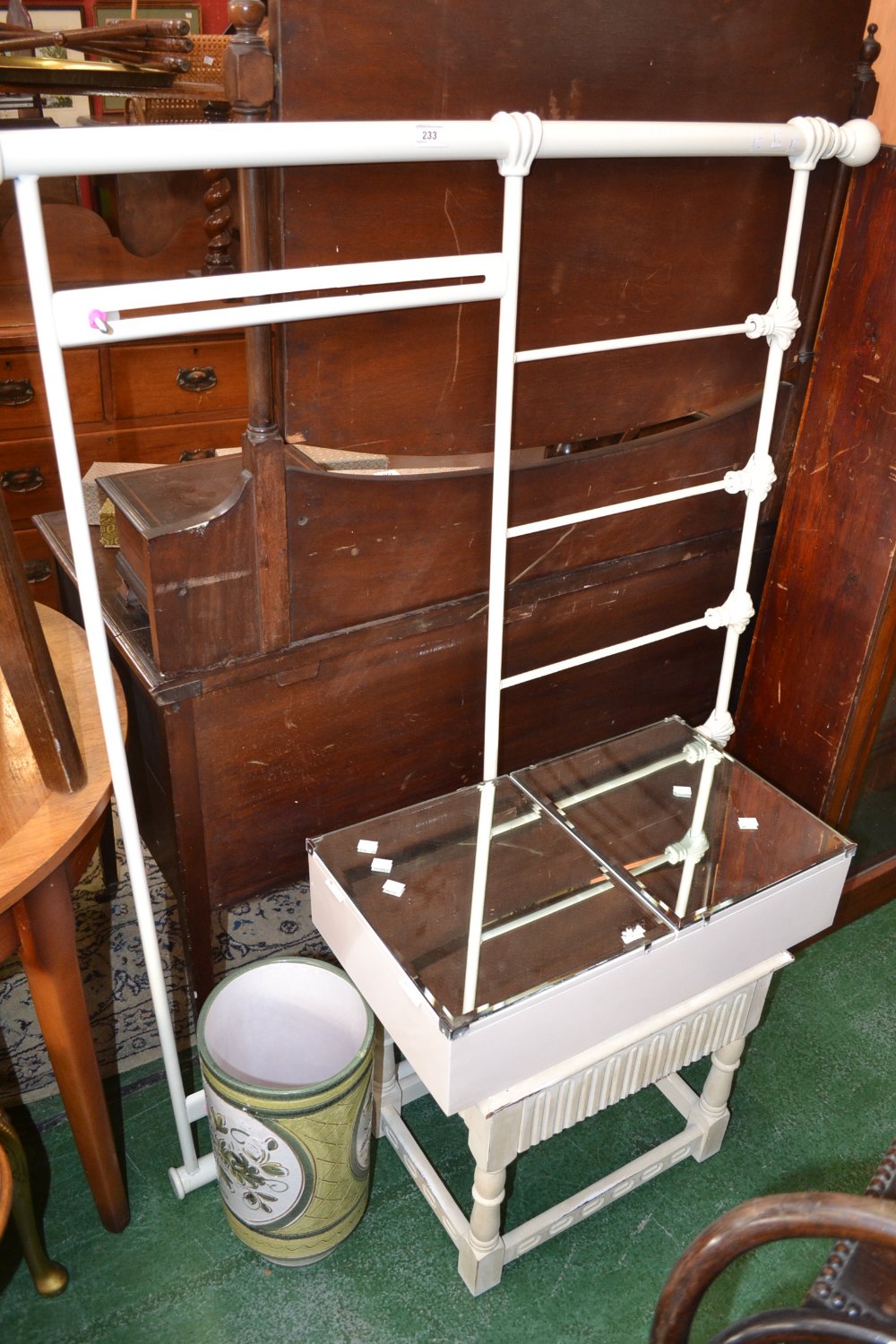 A white painted metal double bed head board; a white painted stool; a bathroom cabinet with