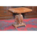 An Indonesian occasional table with elephant base