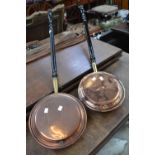 A copper warming pan; another (2)