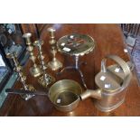 A brass saucepan; a pair of brass candlesticks; another pair, similar; a brass watering can; a