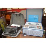 An Imperial typewriter, in fibreglass case; a Marconiphone twin track tape recorder, model 4202