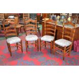 Four ladder back country dining chairs