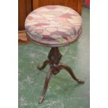 A Victorian cast iron adjustable piano stool, padded circular seat, baluster column, cabriole