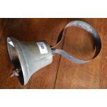 A cast metal bell with tensioned iron work over door hoop mount c.1910