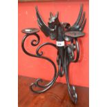 A cast iron two branch dragon wall sconce