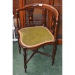 An Edwardian corner chair, curved back, pierced splats with fan shaped patera, turned uprights,