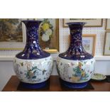 A pair of Chinese baluster vases, decorated with a continuing panel of landscapes and script, the