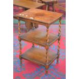 An oak three tier occasional table, barley twist supports, c.1930