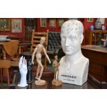 A Phrenology bust; an artists dummy; a wooden carving of Don Quixote; two ceramic hands