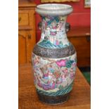 A large Cantonese vase, painted in the Famille Rose palette with figures of the court, on a crackle