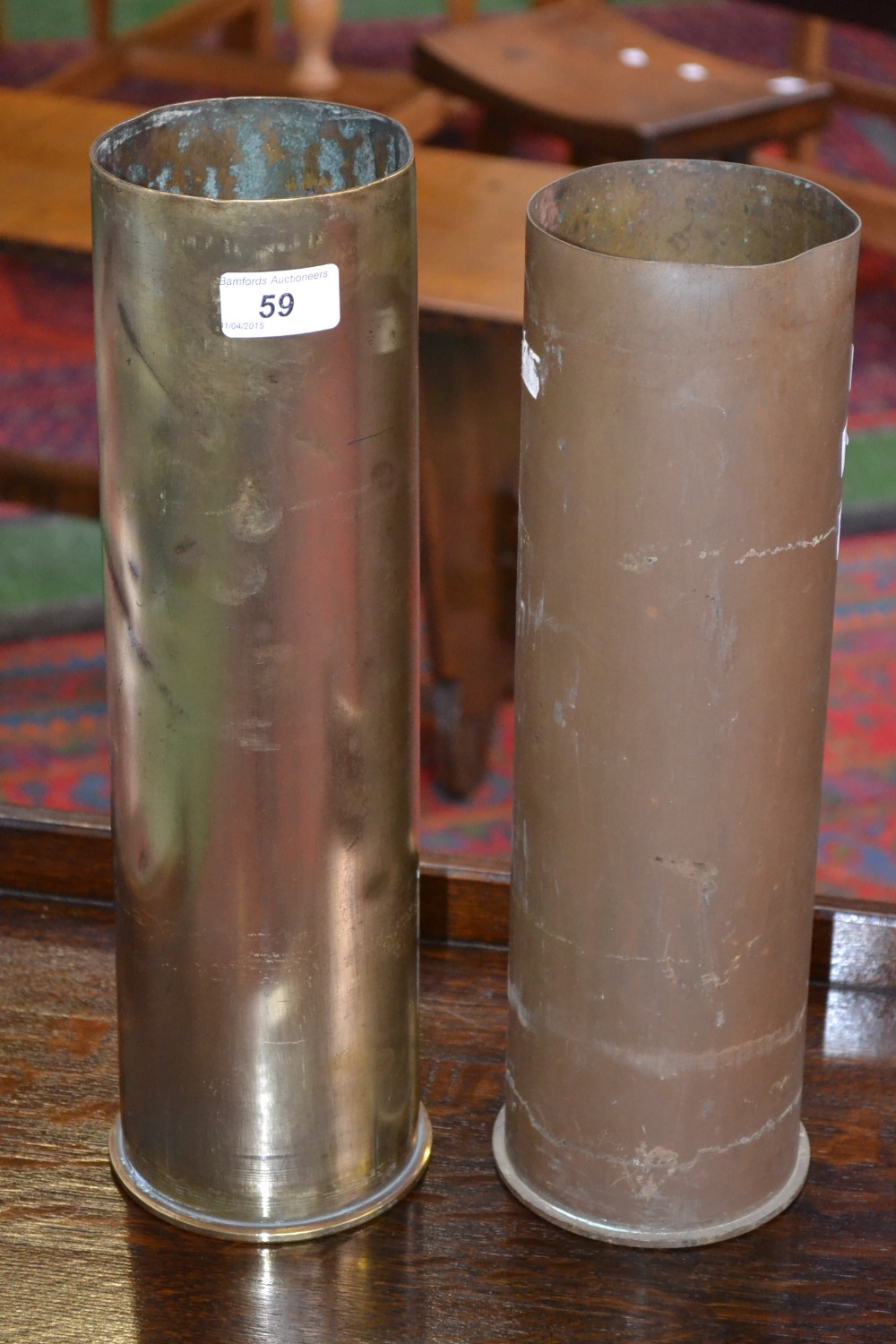 A pair of large French artillery shell casings, circa 1930.