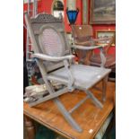An oak office chair, c.1940; a folding garden chair
