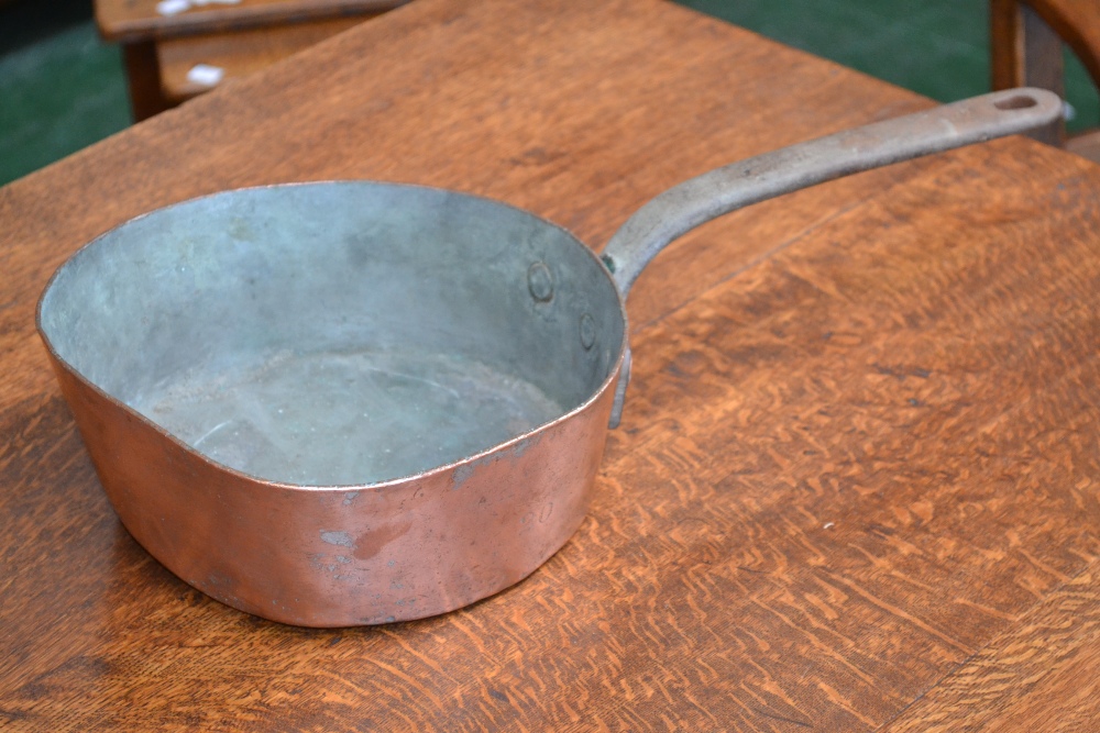 A copper cooking pot, stamped NW20