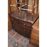 A Victorian mahogany bowfront chest of two short drawers over two long, turned handles, bun feet.