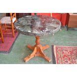 A circular marble topped centre table