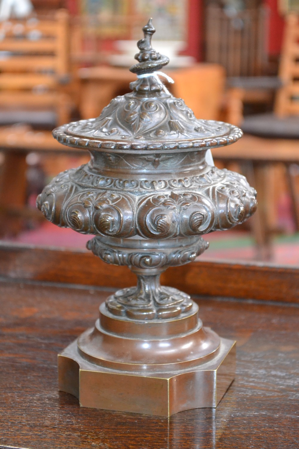 A 19th century French brown patinated bronze compressed campana table urn and cover, serpent