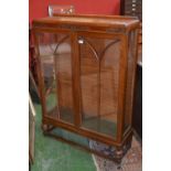 An oak china display cabinet, circa 1930.