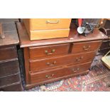 A mahogany chest of two short drawers over two graduated long, brass swing handles