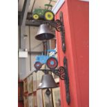 Two cast iron wall mounted tractor bells