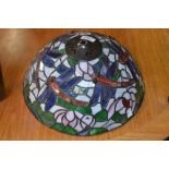 A Tiffany style multi-colour dragonfly lamp shade; another decorated with flowers