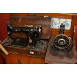 A Singer sewing machine in oak case; another sewing machine