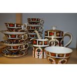 A Royal Crown Derby 1128 tea service for six inc, cups, saucers, side plates, tea pot, milk and