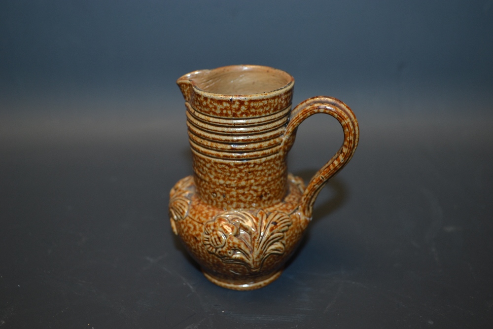 A Derbyshire salt glazed stoneware miniature jug