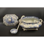 A Chinese Marine tureen, cover and ladle, deocrated in blue and white with willow trees and pagodas