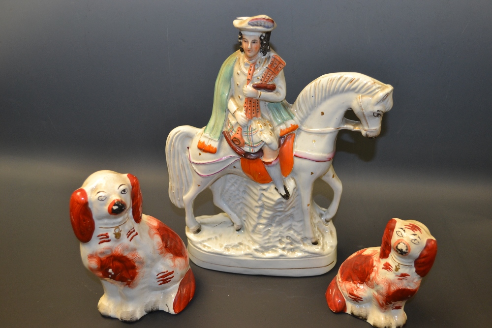 Ceramics - a Stafforshire figure Scotch Piper on Horse back, 29cm high;  a graduated pair of seated