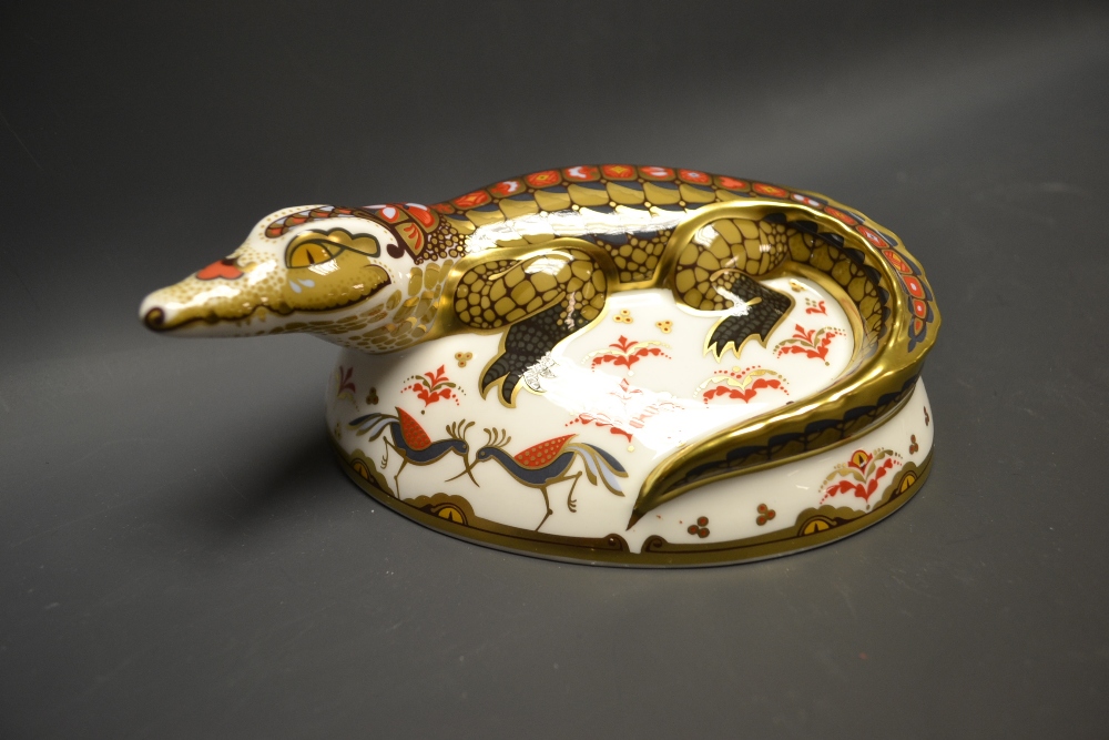 A Royal Crown Derby paperweight, Crocodile, gold stopper, printed marks in red, boxed