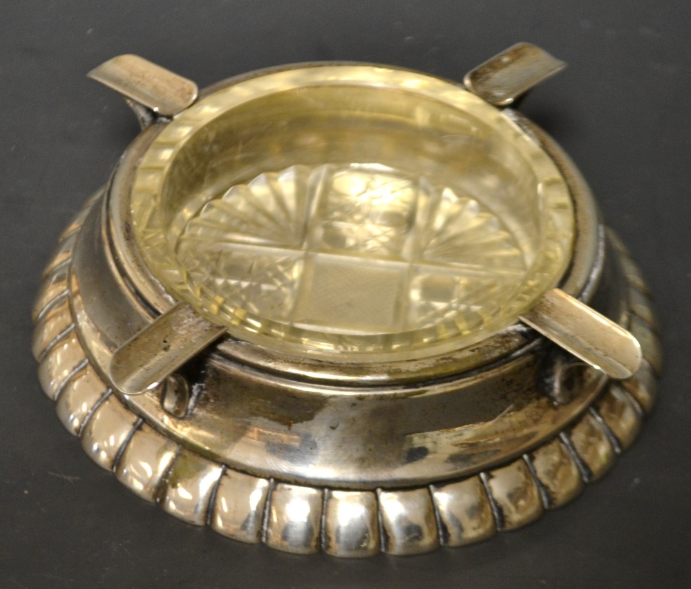 A continental Anglo Hungarian silver ashtray, out wept moulded foot, tapering sides, removable