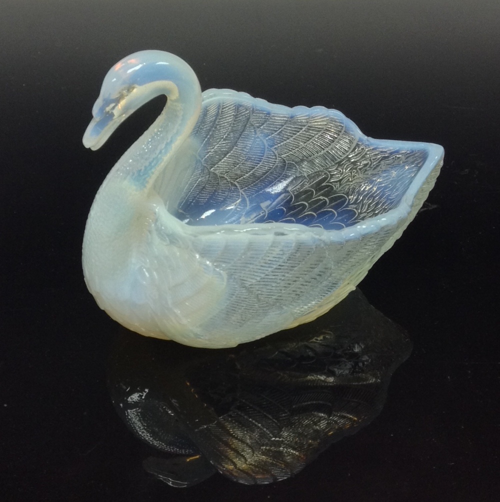 A Burtles and Tate pressed glass opalescent swan, registration number 20086, c.1885