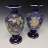 A pair of Royal Doulton baluster vases,