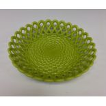 A rare Sowerby aesthetic green pressed glass dished plate, decorated in basket weave relief,