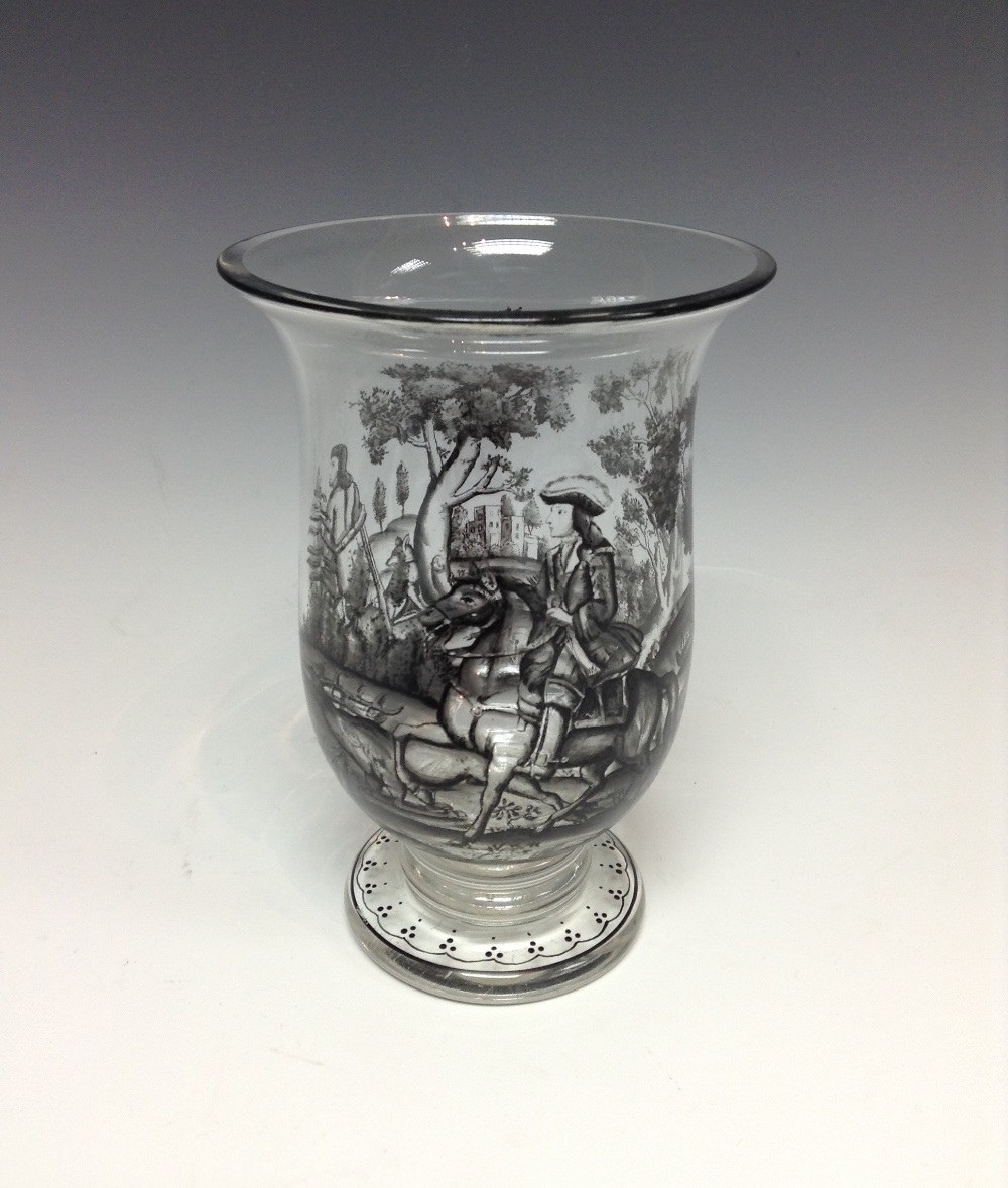 A Bohemian glass vase, the shaped bowl enamelled with a hunting scene, thick rimmed stem, circular