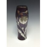 A late 19th/early 20th century Bohemian mauve lustre glass vase, overlaid with flowers in silver,